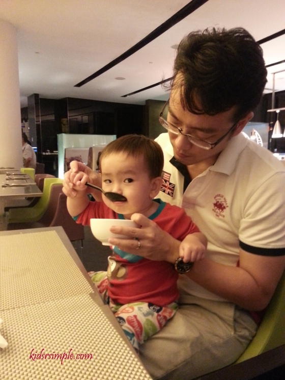 HIs favourite place to drink soup - on his Papa's lap
