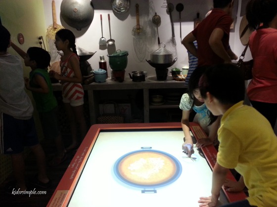 Interactive digital display of cooking different ethnic dishes