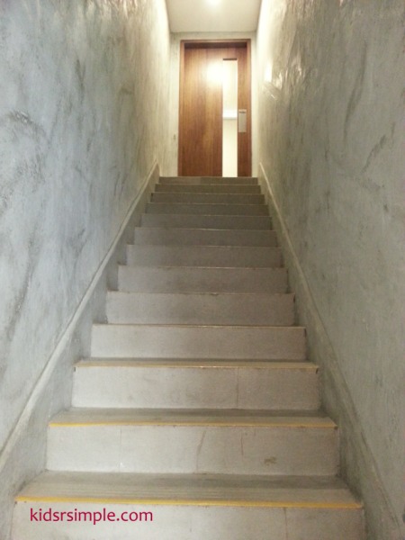 This staircase leads up to the party room, which has a door to shut off all loud excited voices from the children.
